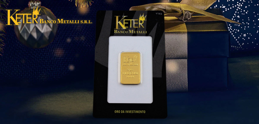 Lingotto d'oro di Keter Banco Metalli presentato in un'elegante confezione natalizia, ideale come regalo prezioso per Natale e perfetto per investimenti a lungo termine.