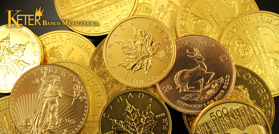 Primo piano di diverse monete d’oro da investimento tra cui il Krugerrand sudafricano, l’American Gold Eagle, il Maple Leaf canadese e il Wiener Philharmoniker austriaco, considerate tra le più ricercate nel 2025 per valore e affidabilità.